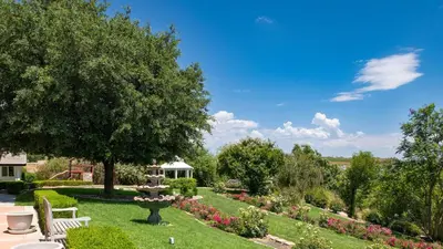 a garden with a fountain and a gazebo at Grand Contento by AvantStay Extraordinary Estate w Pool Movie Room in Temecula