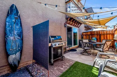 a surfboard is on the wall of a house at Sunsoak Shack in San Diego
