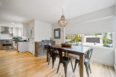 a kitchen and dining room with a table and chairs at The Little Crab Shack in Dana Point