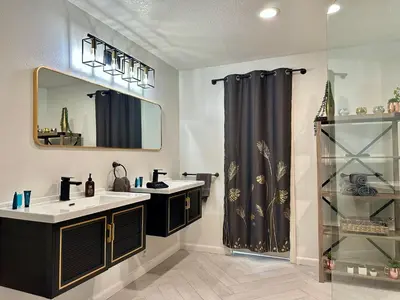 a bathroom with two sinks and a shower at Hilltop Villa, Pool Oasis, Pickleball Court, Avocado Grove, Views in Fallbrook
