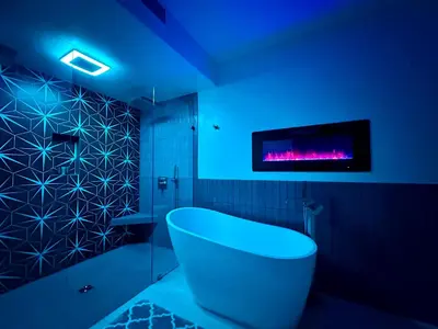a bathroom with a tub and a tv on the wall at Hilltop Villa, Pool Oasis, Pickleball Court, Avocado Grove, Views in Fallbrook