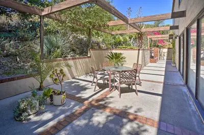 a patio with a table and chairs under a pergola at Unique Coto De Caza Home Near Hiking and Biking in Coto De Caza