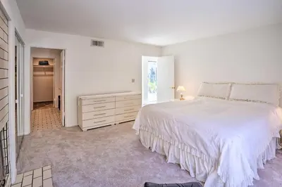 a white bedroom with a large bed and a dresser at Unique Coto De Caza Home Near Hiking and Biking in Coto De Caza