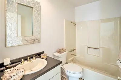 a bathroom with a sink and a toilet and a mirror at Unique Coto De Caza Home Near Hiking and Biking in Coto De Caza