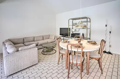 a living room with a table and a couch at Unique Coto De Caza Home Near Hiking and Biking in Coto De Caza