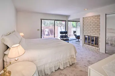 a bedroom with a large bed and a fireplace at Unique Coto De Caza Home Near Hiking and Biking in Coto De Caza
