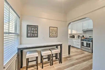a kitchen with a table and stools at Walk to Poway Farmers Market Family Retreat! in Poway