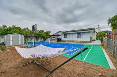 a hammock on a tennis court in a yard at Walk to Poway Farmers Market Family Retreat! in Poway