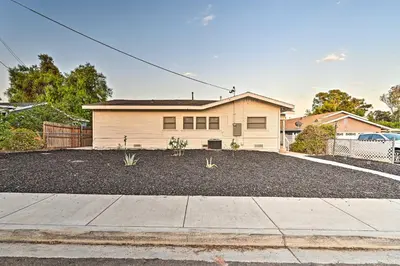 a house with a gravel driveway in front of it at Walk to Poway Farmers Market Family Retreat! in Poway