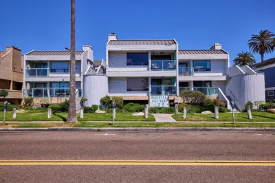 a large house on the side of a street at Fantastic Ocean View Remodeled All New Furnishings Pet Friendly AC in Oceanside