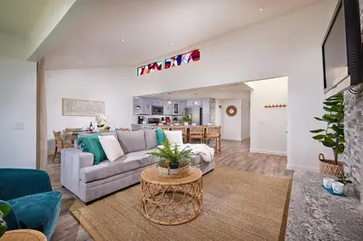 a living room with a couch and a table at Fantastic Ocean View Remodeled All New Furnishings Pet Friendly AC in Oceanside