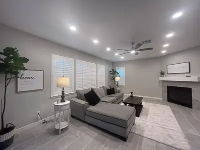 a living room with a couch and a fireplace at San Diego Luxury Oasis in Spring Valley