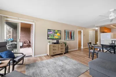 a living room with a table and a dining room at Whitewater Village Retreat B in Oceanside