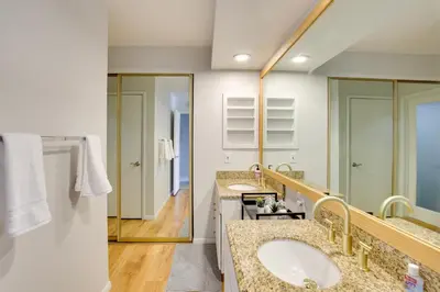a bathroom with two sinks and a large mirror at La Mesa Townhome 15 Mi to San Diego! in La Mesa