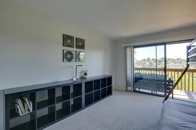 a bedroom with a view of a balcony at La Mesa Townhome 15 Mi to San Diego! in La Mesa