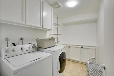 a white laundry room with a washer and dryer at La Mesa Townhome 15 Mi to San Diego! in La Mesa