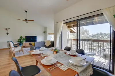 a dining room and living room with a table and chairs at La Mesa Townhome 15 Mi to San Diego! in La Mesa