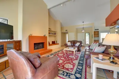 a living room with leather furniture and a fireplace at Pet-Friendly Borrego Springs Retreat in Borrego Springs