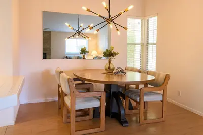 a dining room with a table and chairs at Silver Sands Den in Hemet