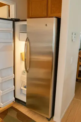 a refrigerator with its door open in a kitchen at Silver Sands Den in Hemet