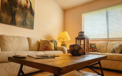 a living room with a couch and a table at Sundance Retreat in Hemet