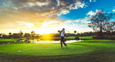 a man swinging a golf club on a golf course at Sundance Retreat in Hemet