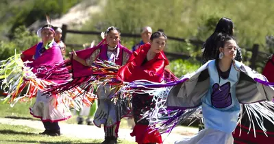 a group of women performing a dance in the grass at Sundance Retreat in Hemet