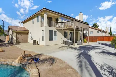 a house with a swimming pool in a yard at Pool-BBQ-View-Balcony-Fireplace-King-Garage-WD in Lake Elsinore