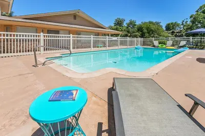 a swimming pool with a blue table in front of a house at Charming 2 Room La Mesa Casita w/ Pool, BBQ & Yard in La Mesa