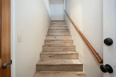 a staircase with wooden steps in a house at Charming 2 Room La Mesa Casita w/ Pool, BBQ & Yard in La Mesa