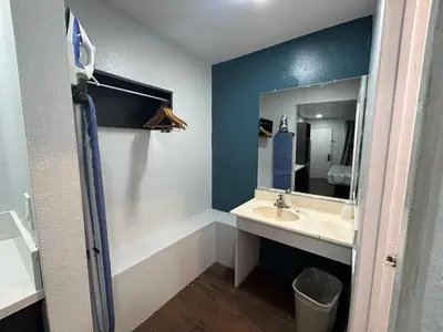 a bathroom with a sink and a mirror at Studio 6 Hemet, CA in Hemet