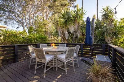 a patio with a table and chairs on a deck at Solana Beach House! Minutes to Dog Beach & Cedros in Solana Beach
