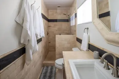 a bathroom with a sink and a toilet and a tub at Solana Beach House! Minutes to Dog Beach & Cedros in Solana Beach