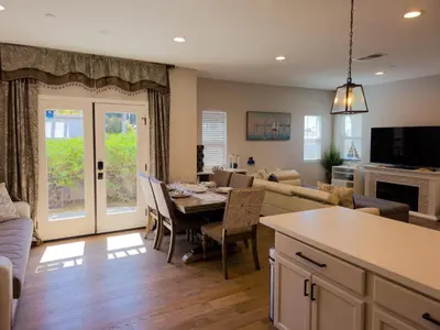 a kitchen and living room with a table and chairs at Modern comfort, prime location, 360 views, 4 BR entire house in San Diego