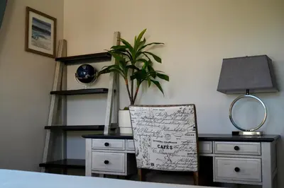 a bedroom with a desk with a chair and a mirror at Modern comfort, prime location, 360 views, 4 BR entire house in San Diego