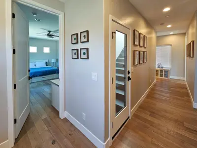 a hallway with a room with a bed and a door at Modern comfort, prime location, 360 views, 4 BR entire house in San Diego