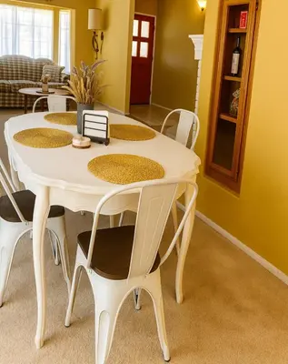 a white table and chairs in a living room at Willow brook room with TV in Hemet