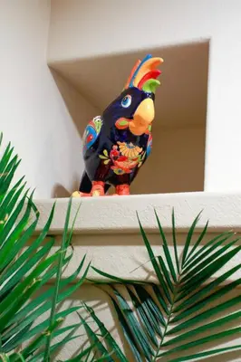 a toy bird sitting on top of a shelf at Mi Casa es Su Casa! (My Home is Your Home!) in Vista