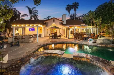a house with a swimming pool in front of a house at Mi Casa es Su Casa! (My Home is Your Home!) in Vista