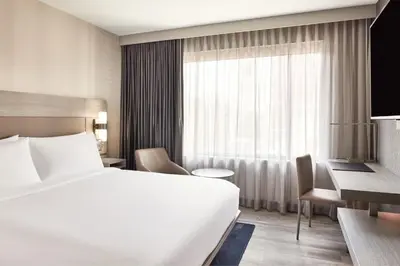 a hotel room with a bed and a window at AC Hotel by Marriott San Diego Downtown Gaslamp Quarter in San Diego