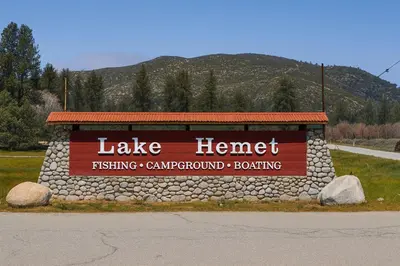 a sign for a lake henrett fishing campground bombing at Rosewood Retreat in Hemet