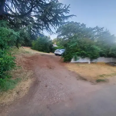 a car parked on the side of a dirt road at Cozy, Cheerful & Charming Cabin - Historic Julian in Julian