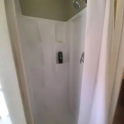 a bathroom with a shower with a white shower curtain at Cozy, Cheerful & Charming Cabin - Historic Julian in Julian