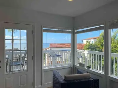 a room with a balcony with views of the ocean at Blue Whale Inn San Clemente Charmer Unit A in San Clemente