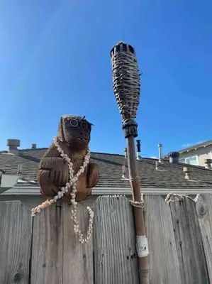 a owl decoration on a wooden fence with a pole at Blue Whale Inn Pet and Kid Friendly Unit C in San Clemente