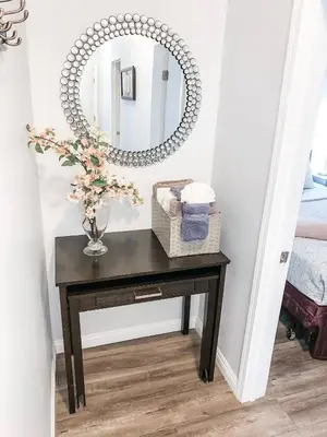 a black console table with a mirror on it at Gaslamp 2BR Suite Free Parking Convention Walk in San Diego
