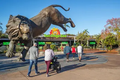 a group of people walking past a statue of a dog at Gaslamp 2BR Suite Free Parking Convention Walk in San Diego