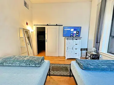 a room with two beds and a television in it at 2BR Downtown Suite Free Parking - Conv Center in San Diego
