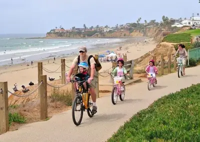 a group of people riding bikes on the beach at 2BR Downtown Suite Free Parking - Conv Center in San Diego