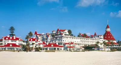 a large building with red roofs on a beach at Top Floor Conv Center Free Parking 4 Beds in San Diego